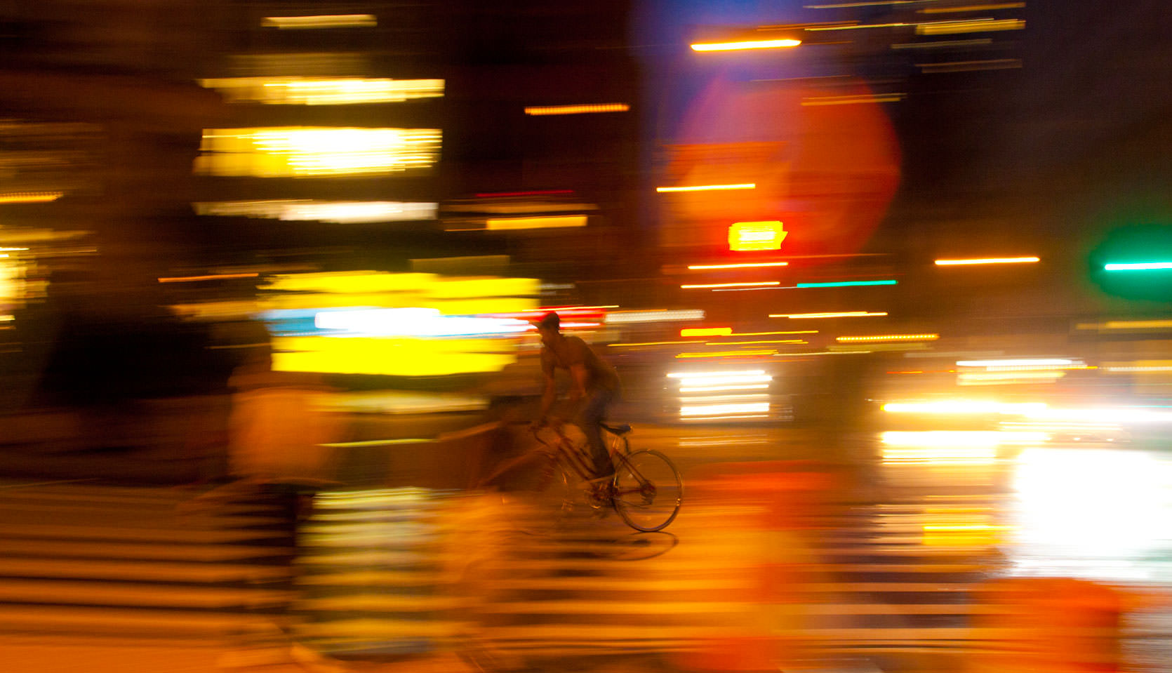 Union Square at Night Photo.  Biker in New York City.