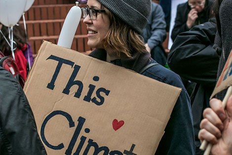 Protest sign calling for divestment from dirty fuel