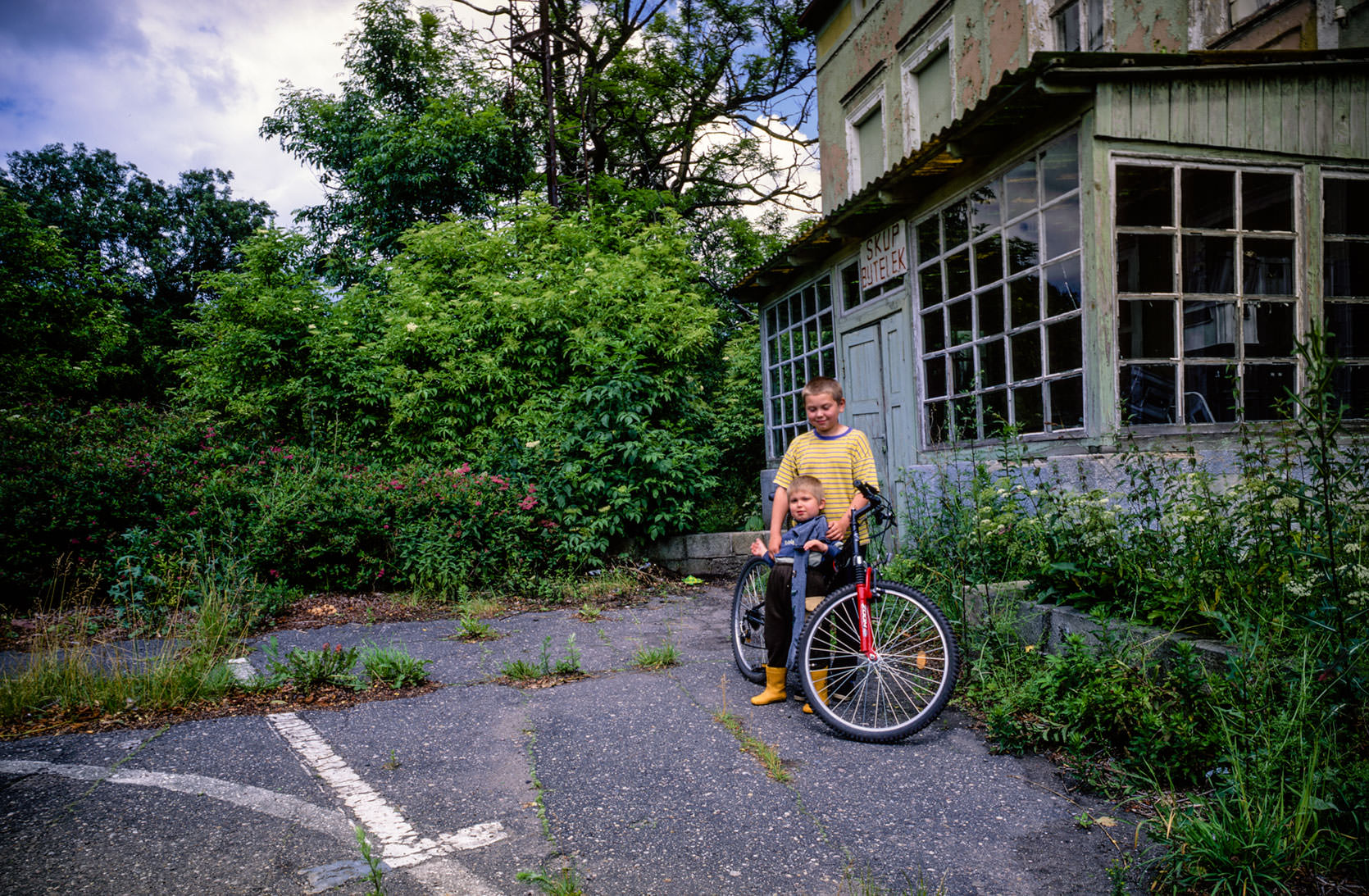 Boys playing near wheat mill in Pomerania