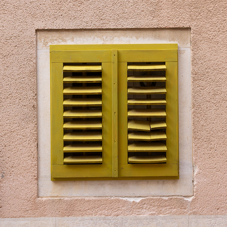 Yellow-green window in Rovinj, Croatia