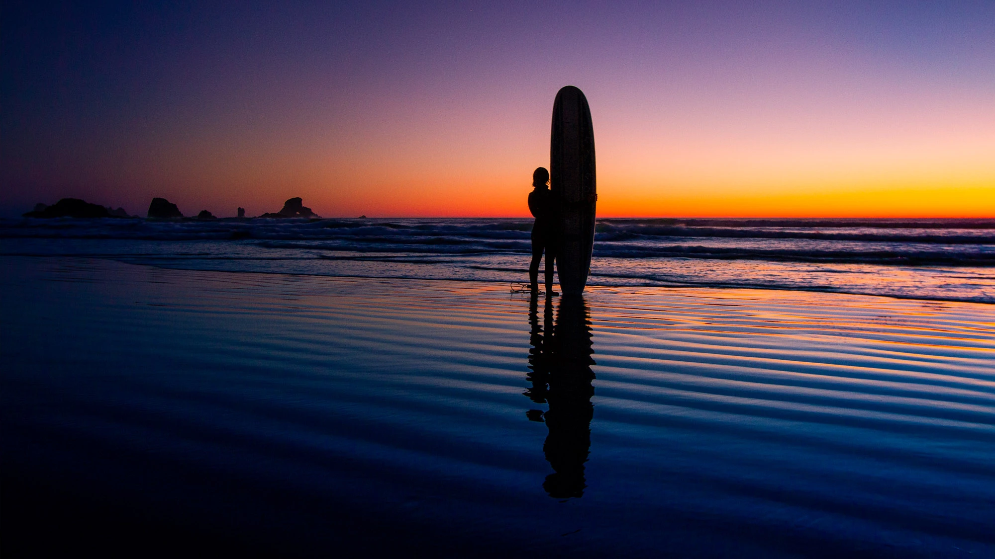 Narrow dusk alley in Rovinj, Croatia—warm stone walls, glowing windows and lantern light, polished cobbles tapering toward the sea—an invitation to wander and discover Europe.