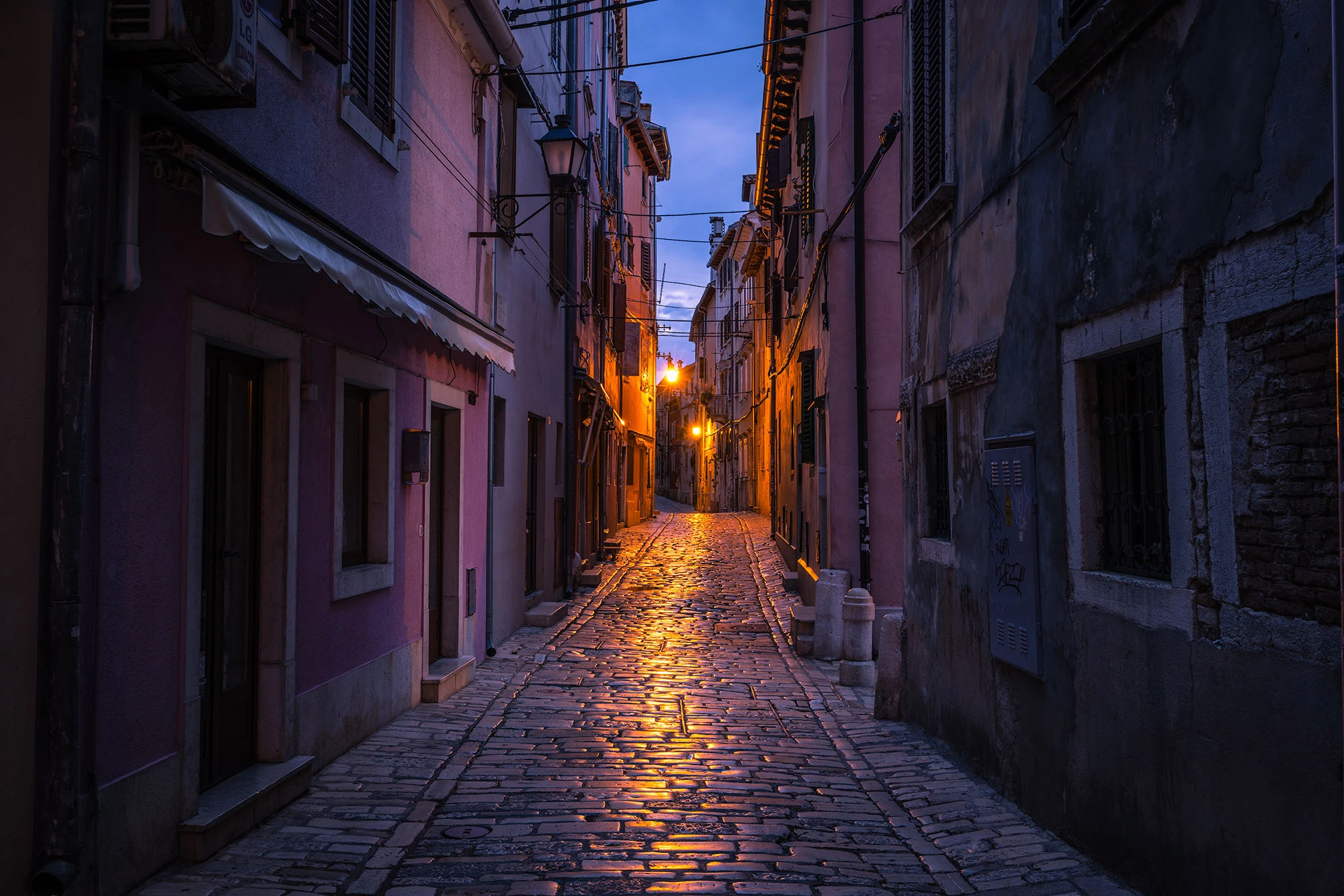 Streetlights illuminate the cobblestones of Vladimira Švalbe Street in Rovinj.